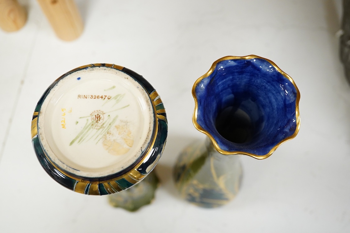 A pair of early 20th century Moorcroft MacIntrye Florian green and gold vases, signed and stamped to the bases, 29cm high